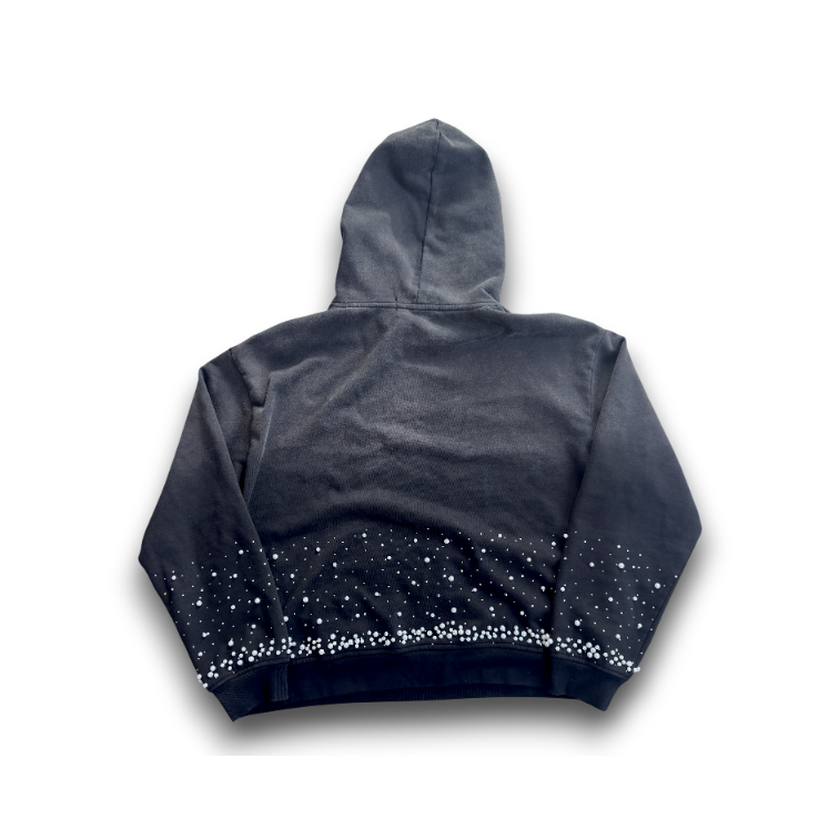 A dark gray and black gradient hoodie with a starry pattern along the hem, shown from the back against a black background.